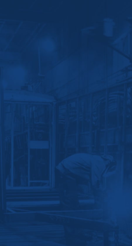 A dark blue tinted background image of two men building trailers.
